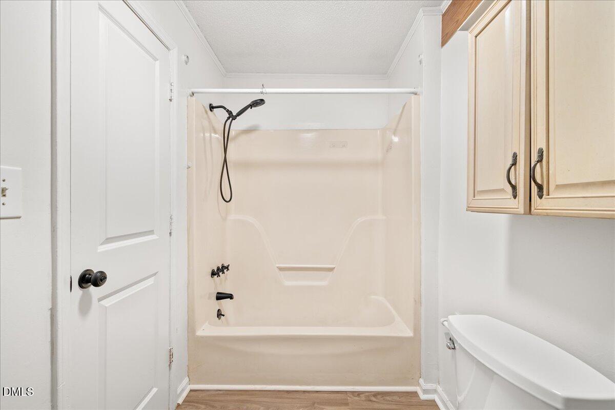 108 West Garner Road Garner, NC 27529 - Photo 20 of 53 a bathroom with a shower a toilet and a window