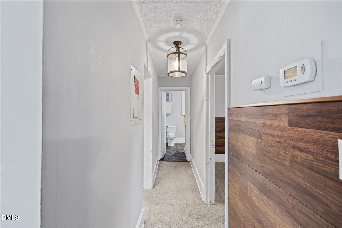108 West Garner Road Garner, NC 27529 - Photo 38 of 53 a view of a hallway with wooden floor and staircase