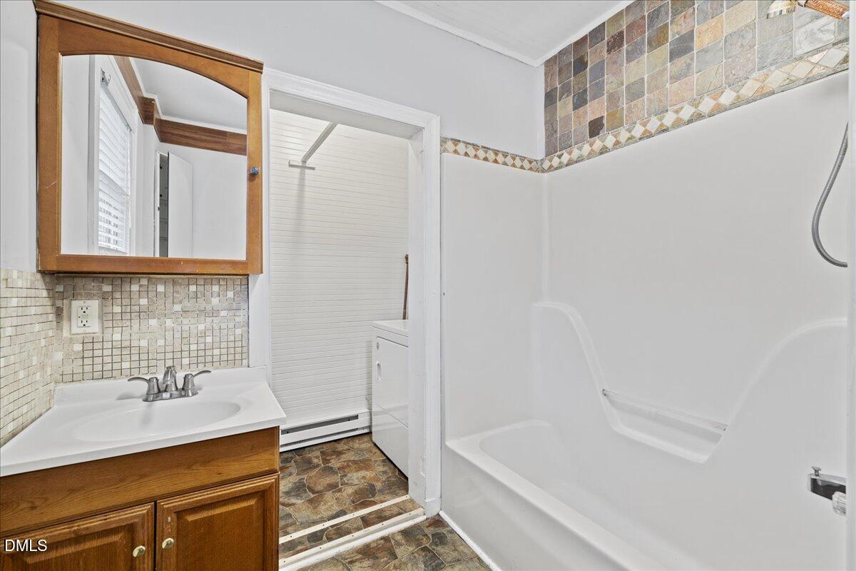 108 West Garner Road Garner, NC 27529 - Photo 42 of 53 a bathroom with a sink and a bathtub