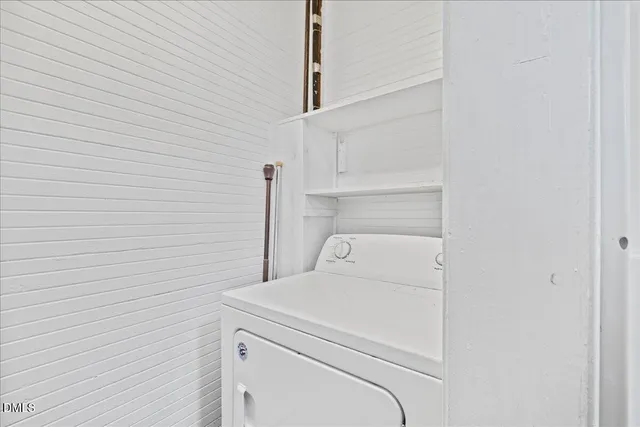 a bathroom with a granite countertop mirror and a shower