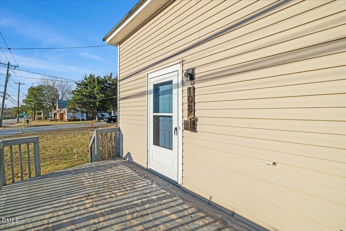 108 West Garner Road Garner, NC 27529 - Photo 5 of 53 a view of a balcony with wooden floor and fence