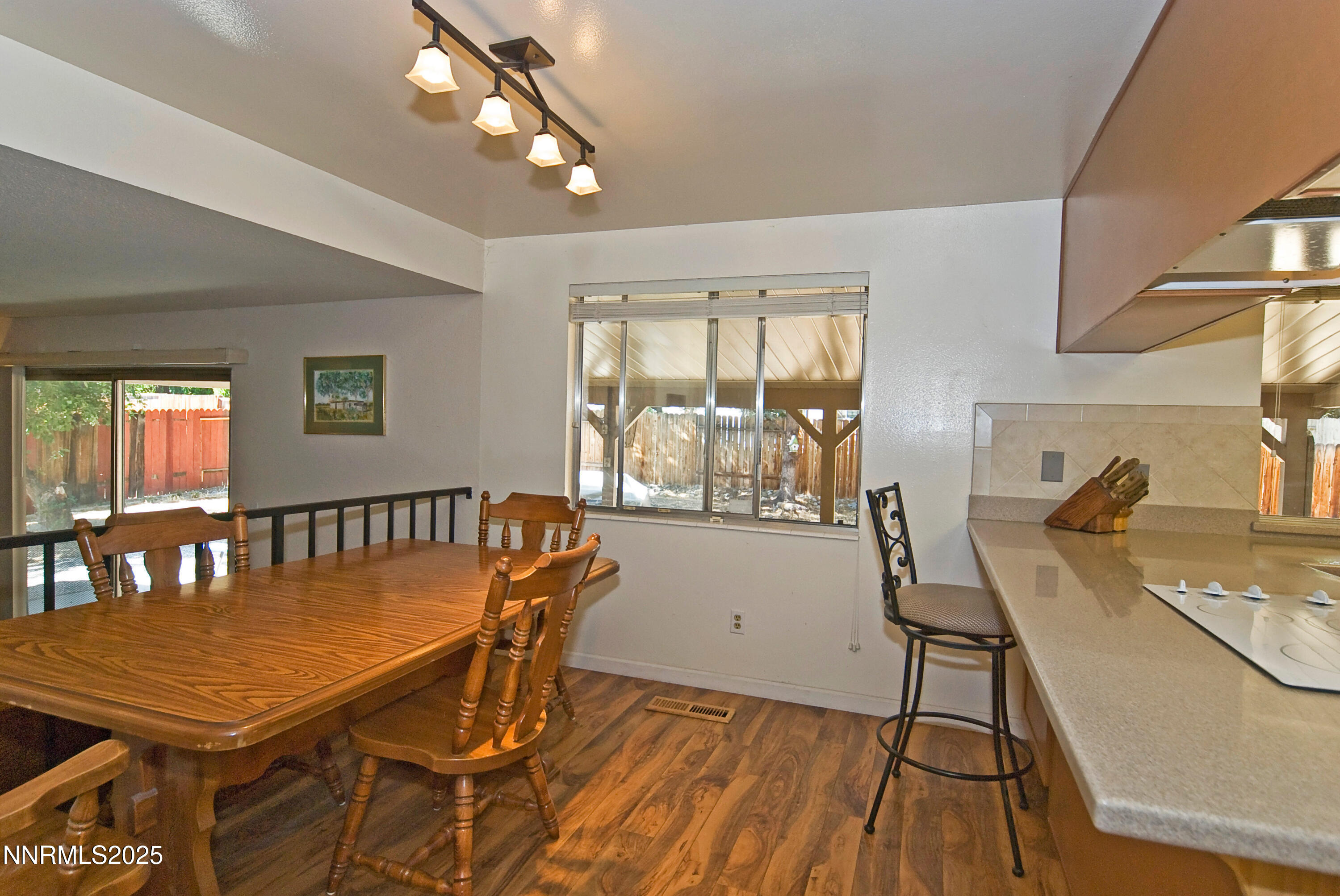 4875 Golden Springs Drive Reno, NV 89509 - Photo 12 of 33 a view of a dining room with furniture window and wooden floor