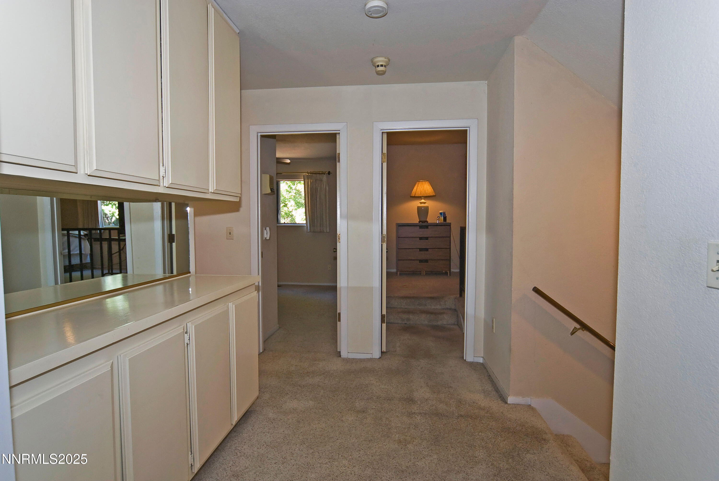 4875 Golden Springs Drive Reno, NV 89509 - Photo 18 of 33 hallway with wooden floor and cabinets