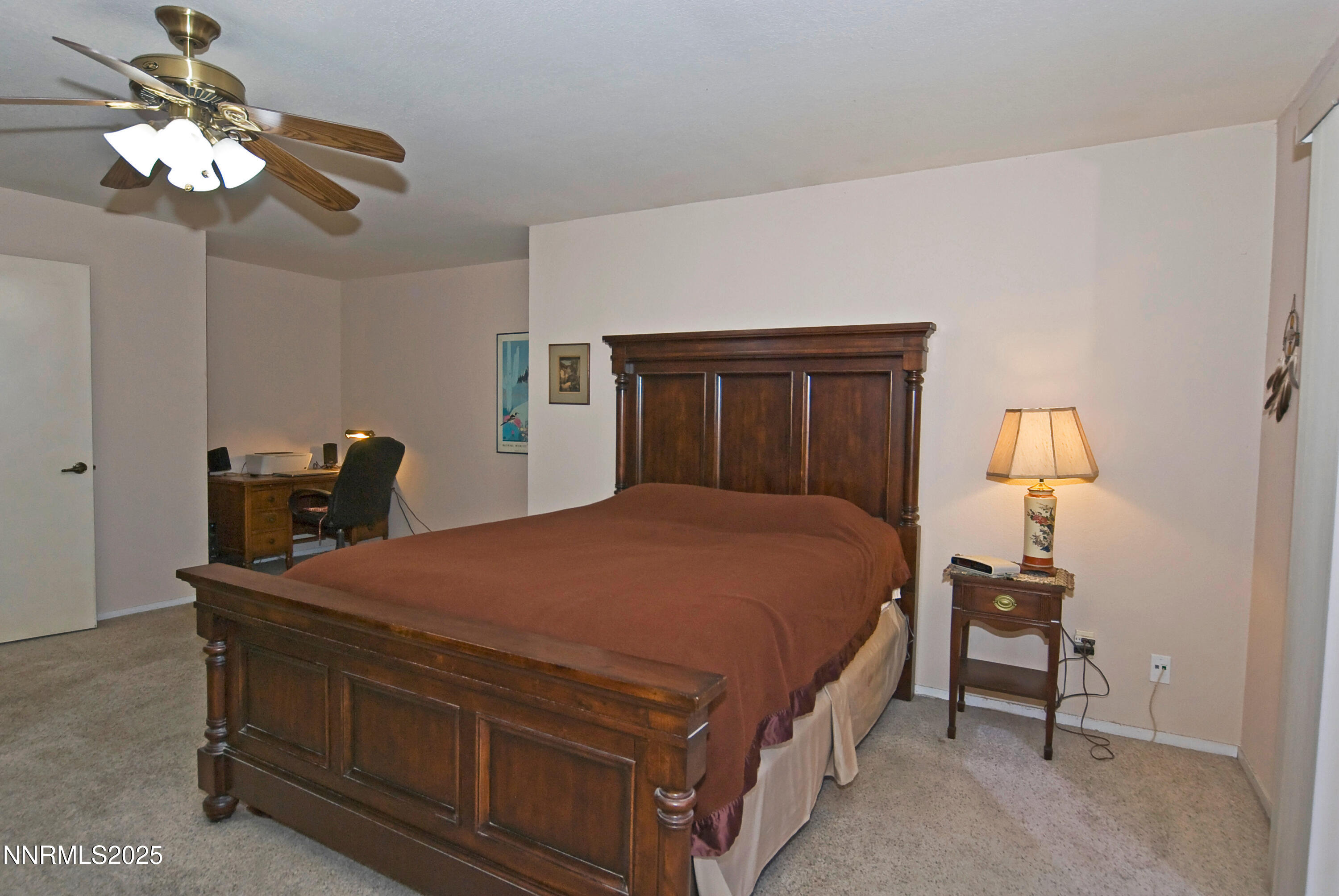 4875 Golden Springs Drive Reno, NV 89509 - Photo 20 of 33 a bed room with a bed and a chandelier