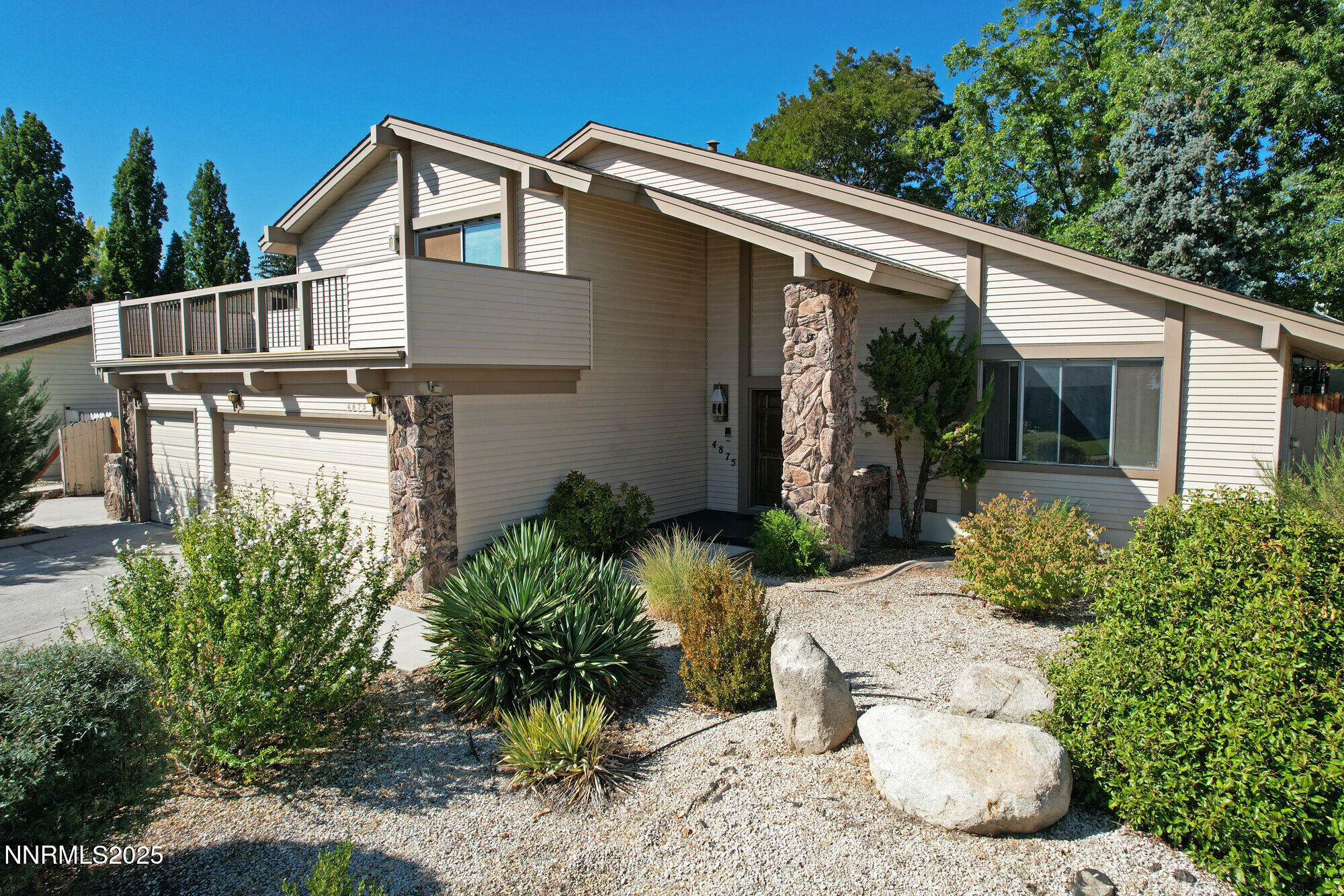 4875 Golden Springs Drive Reno, NV 89509 - Photo 2 of 33 a view of a patio with table and chairs potted plants