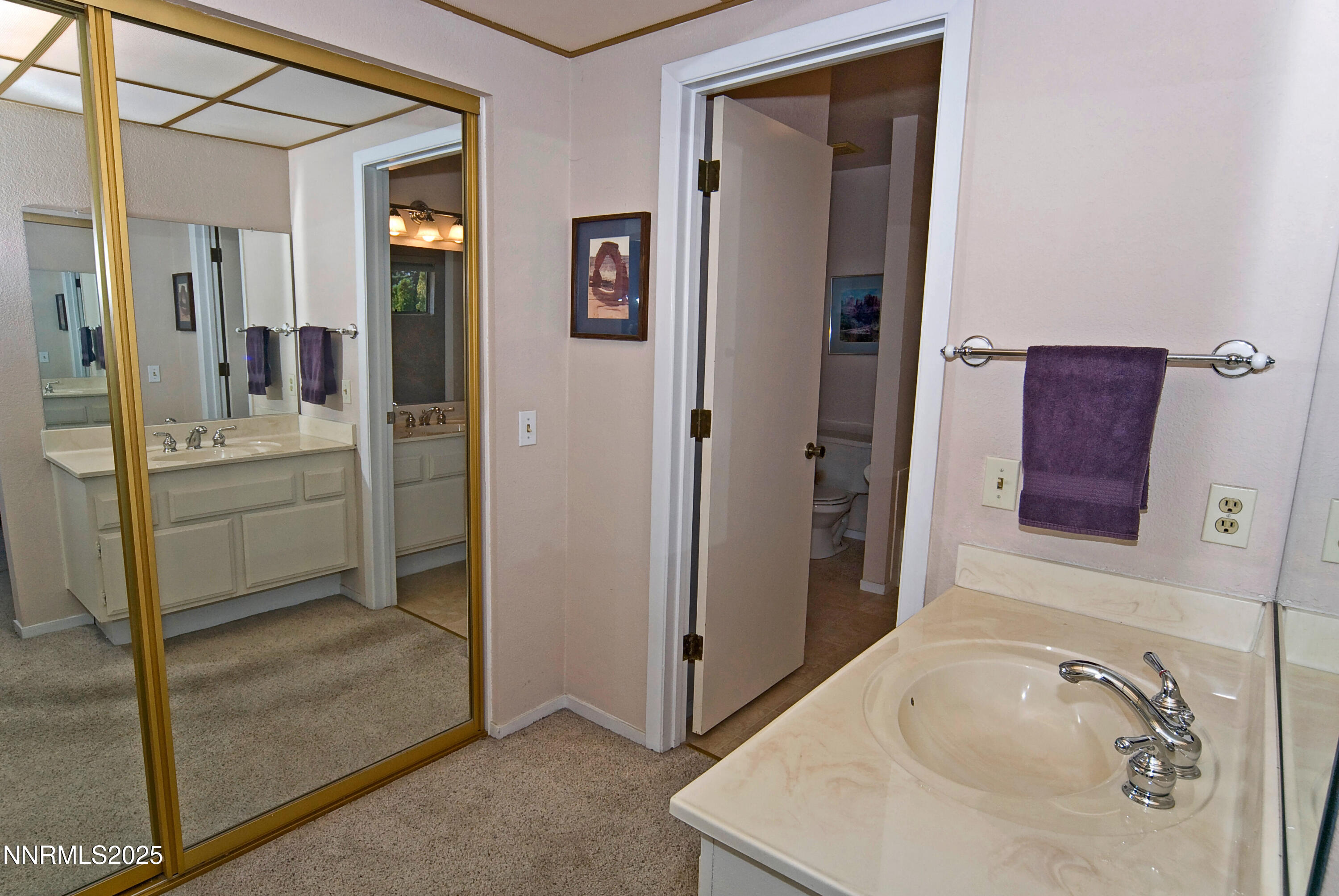4875 Golden Springs Drive Reno, NV 89509 - Photo 23 of 33 a bathroom with a tub sink and mirror