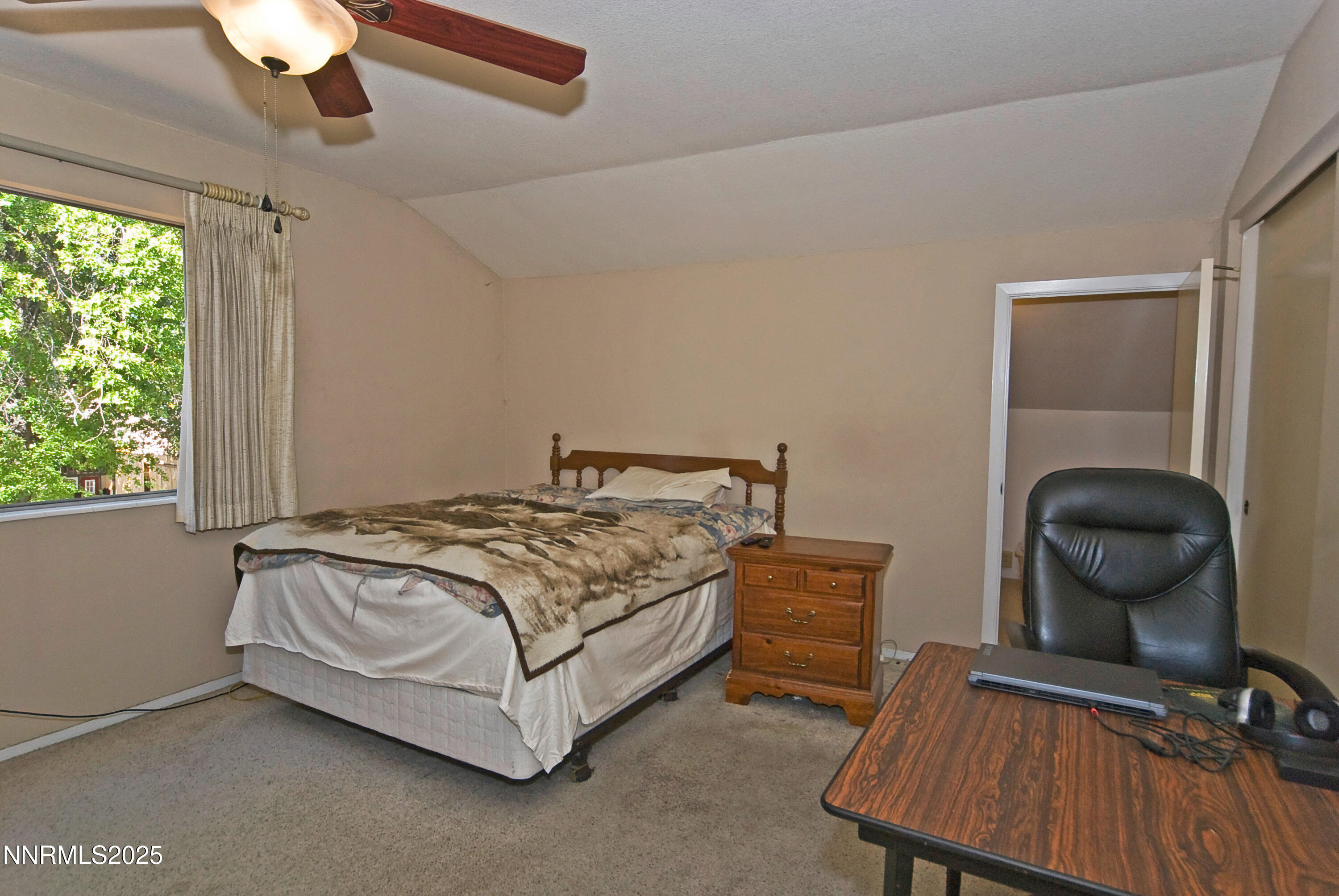 4875 Golden Springs Drive Reno, NV 89509 - Photo 26 of 33 a bedroom with a bed and a chair