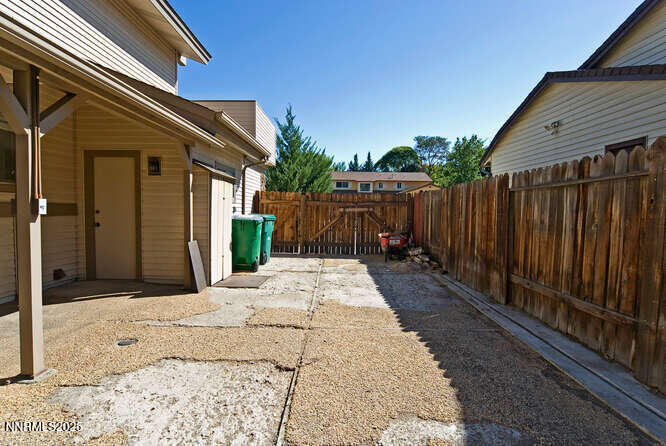 4875 Golden Springs Drive Reno, NV 89509 - Photo 32 of 33 a view of backyard with small cabin and wooden fencing