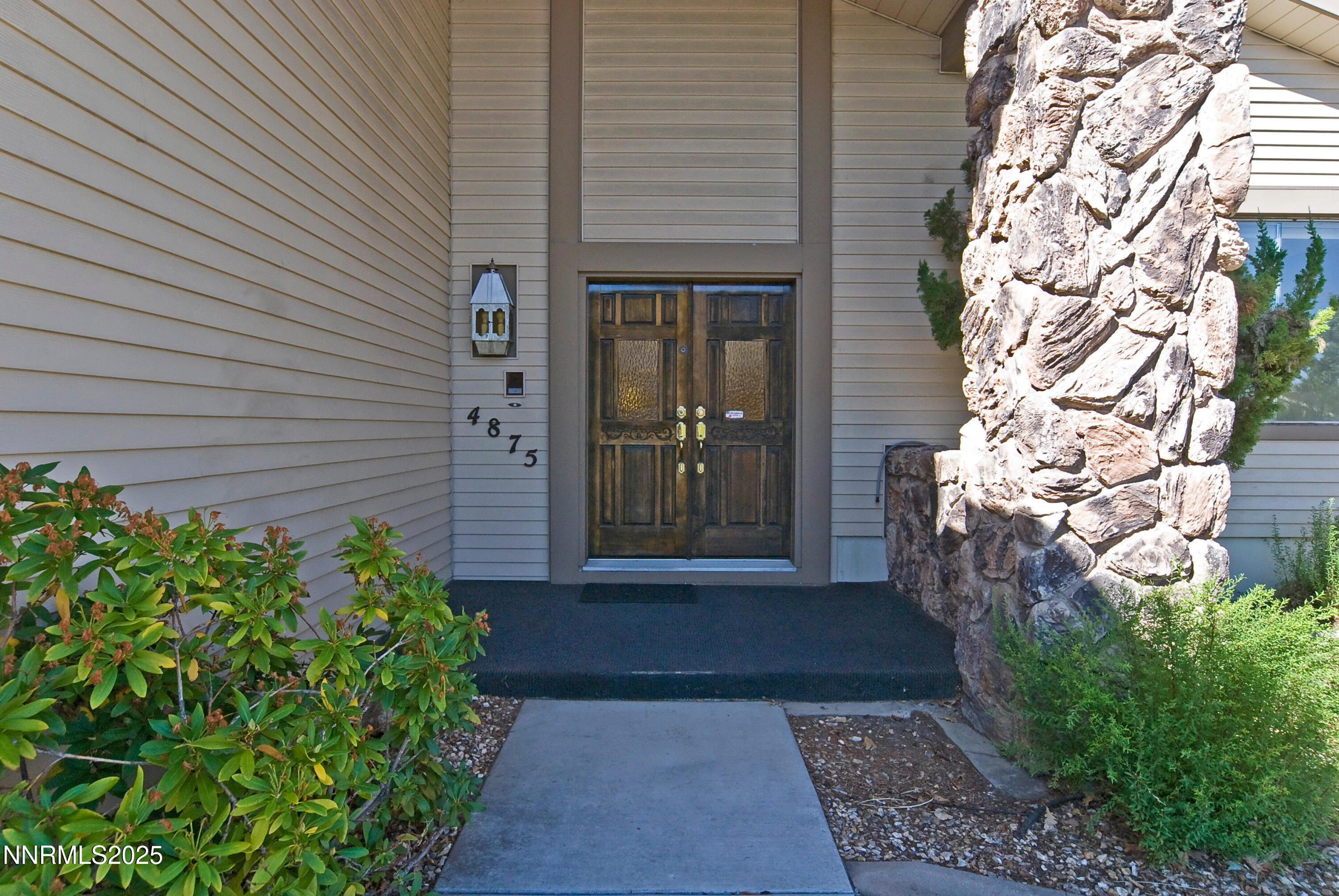 4875 Golden Springs Drive Reno, NV 89509 - Photo 4 of 33 a front view of a house with a yard