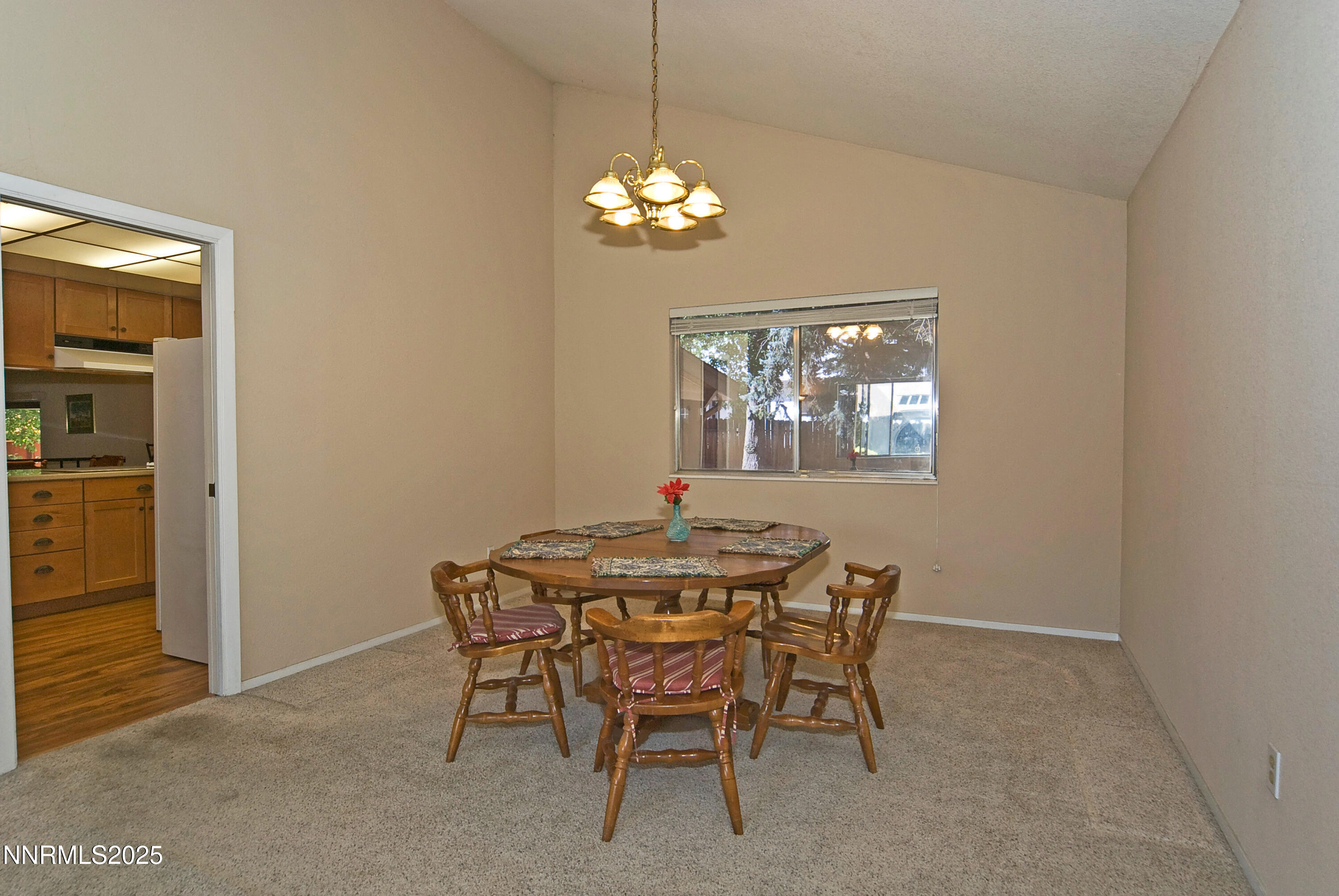 4875 Golden Springs Drive Reno, NV 89509 - Photo 8 of 33 a dining room with a chandelier and a dining table
