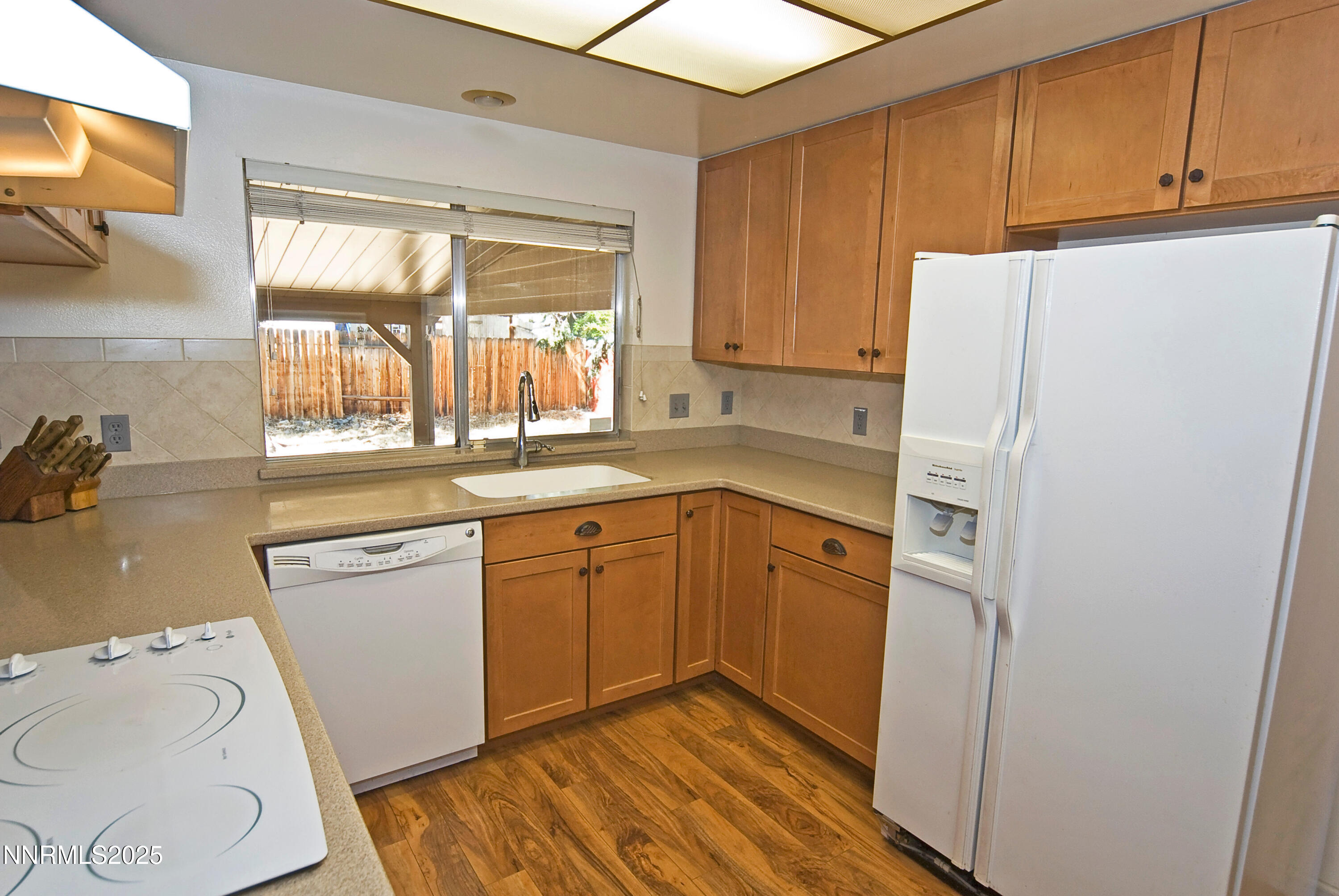 4875 Golden Springs Drive Reno, NV 89509 - Photo 9 of 33 a kitchen with a refrigerator sink and cabinets