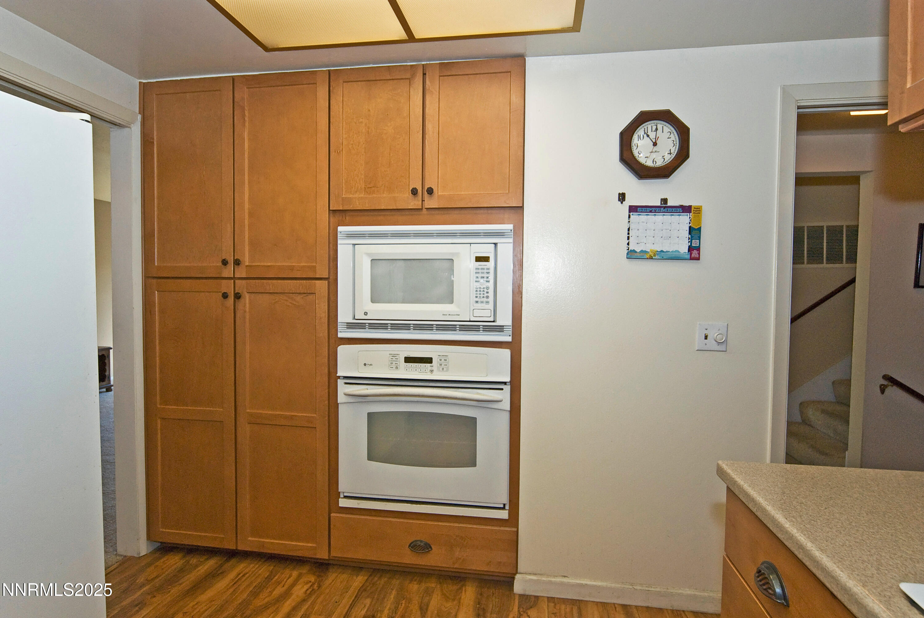 4875 Golden Springs Drive Reno, NV 89509 - Photo 10 of 33 a kitchen with a refrigerator and cabinets