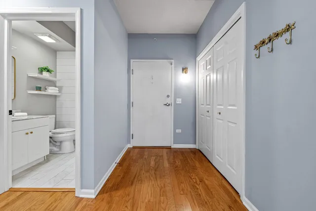 a bathroom with a granite countertop toilet sink and shower