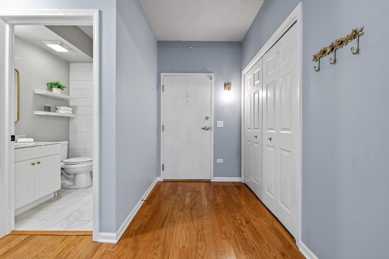 133 West Palatine Road, Unit 108 Palatine, IL 60067 - Photo 21 of 37 a bathroom with a granite countertop toilet sink and shower
