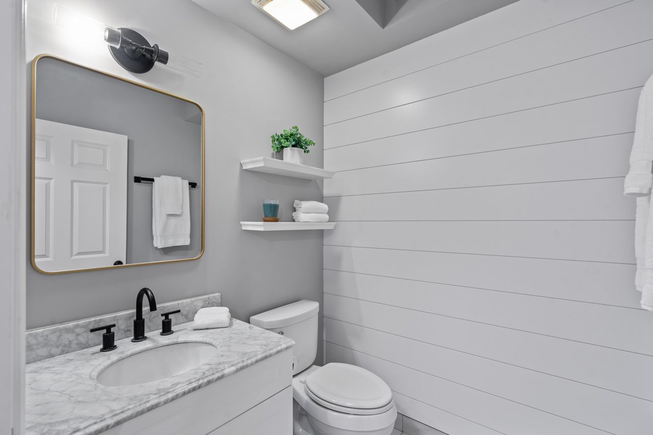 133 West Palatine Road, Unit 108 Palatine, IL 60067 - Photo 22 of 37 a bathroom with a granite countertop sink toilet and mirror