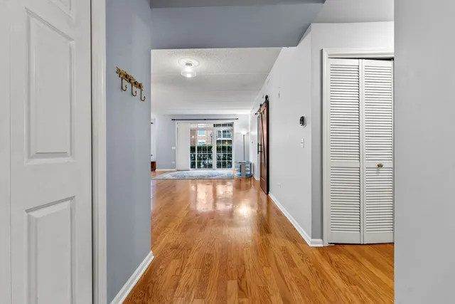 a view of gallery with wooden floor