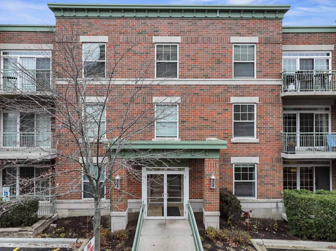 133 West Palatine Road, Unit 108 Palatine, IL 60067 - Photo 36 of 37 a front view of a building with many windows