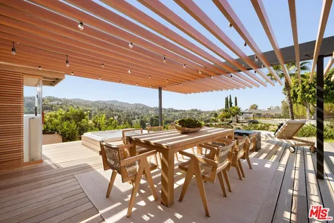 a view of swimming pool with outdoor seating