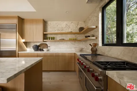 a kitchen with a stove and a sink