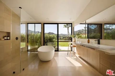 a living room with a large window and a table