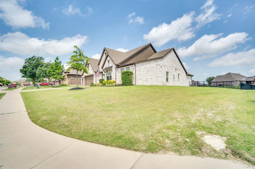 1601 Bear Path Way Gunter, TX 75058 - Photo 37 of 40 a view of a house with a backyard and a garden