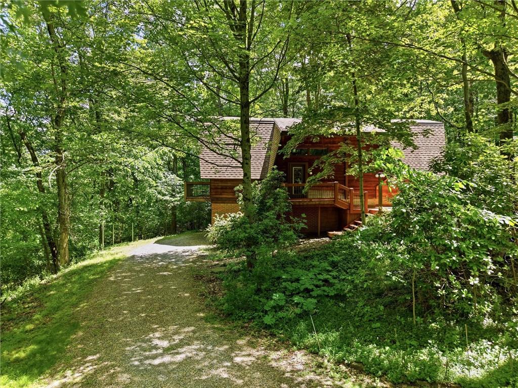 6110 Saltsburg Road Murrysville, PA 15668 - Photo 39 of 47 a backyard of a house with lots of green space