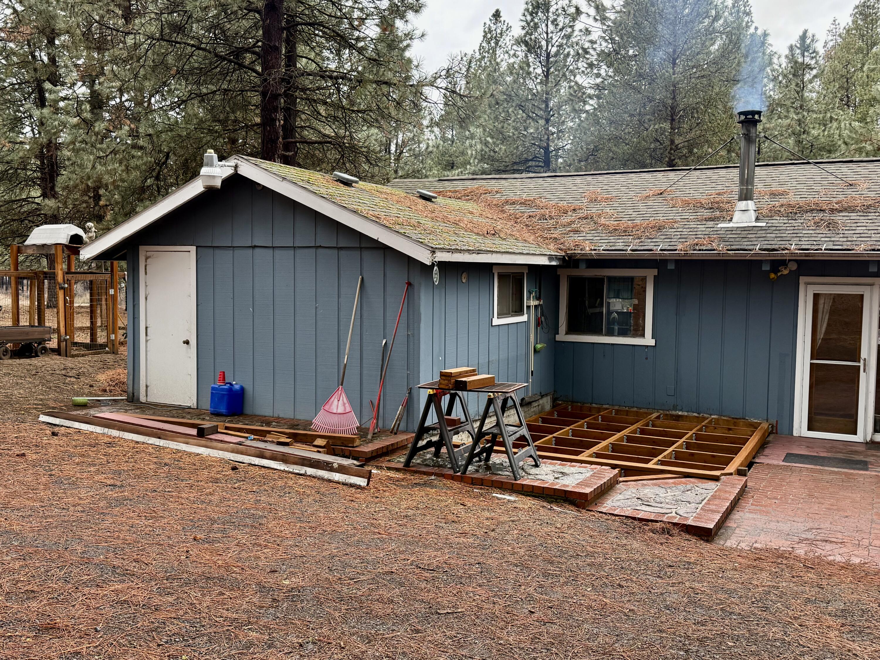 38965 Chiloquin Ridge Road Chiloquin, OR 97624 - Photo 4 of 59 a backyard of a house with table and chairs