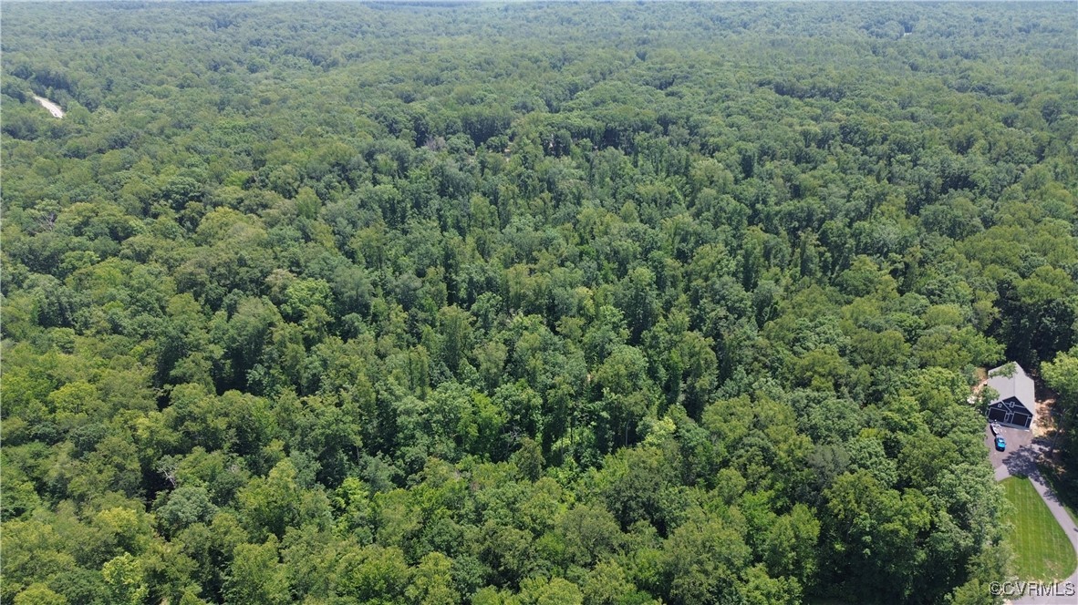 0 Stavemill Road Powhatan, VA 23139 - Photo 14 of 17 an outdoor view of house with green space