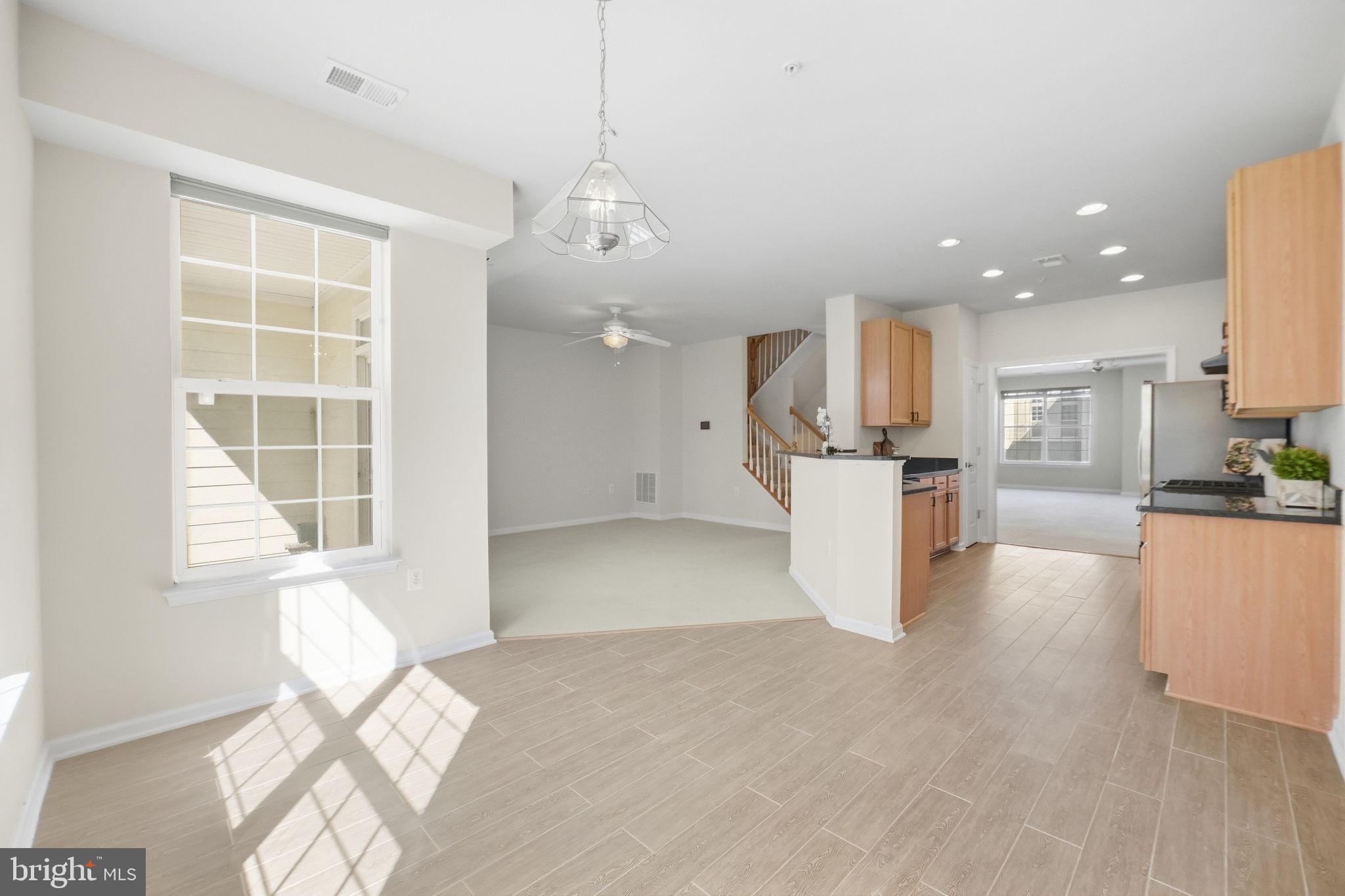 2212 Highfly Terrace, Unit 2212 Silver Spring, MD 20902 - Photo 9 of 41 Open concept eat in kitchen and family den