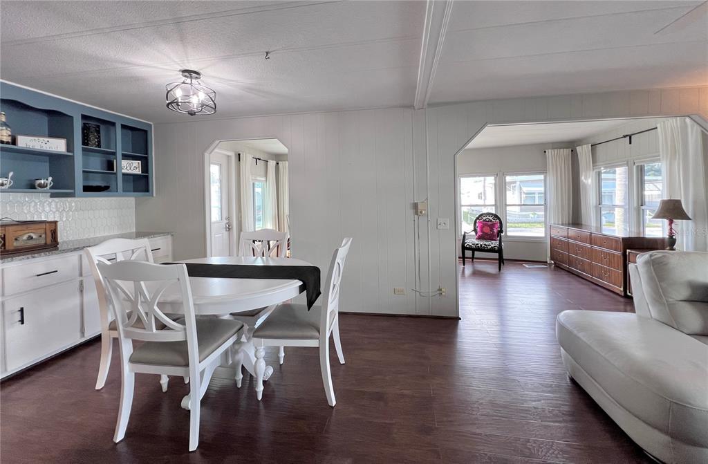 1100 South Belcher Road, Unit 772 Largo, FL 33771 - Photo 19 of 84 a view of a dining room with furniture and wooden floor