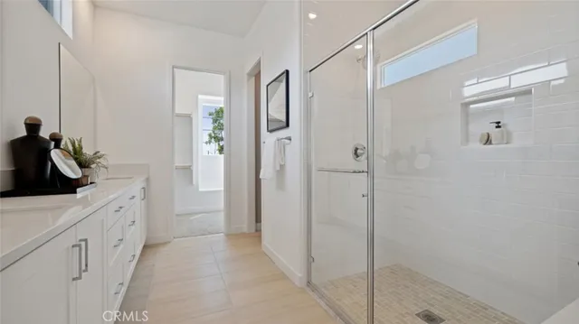 a bathroom with a shower and a sink