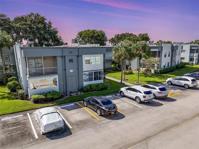 a view of backyard with outdoor seating and green space