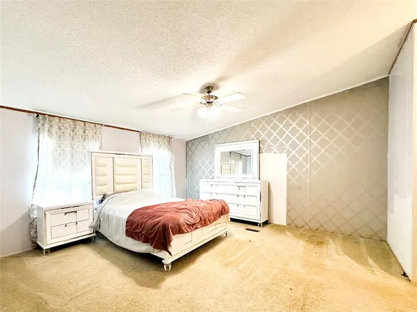 a view of a room with a wooden floor