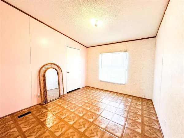 a view of an empty room with windows