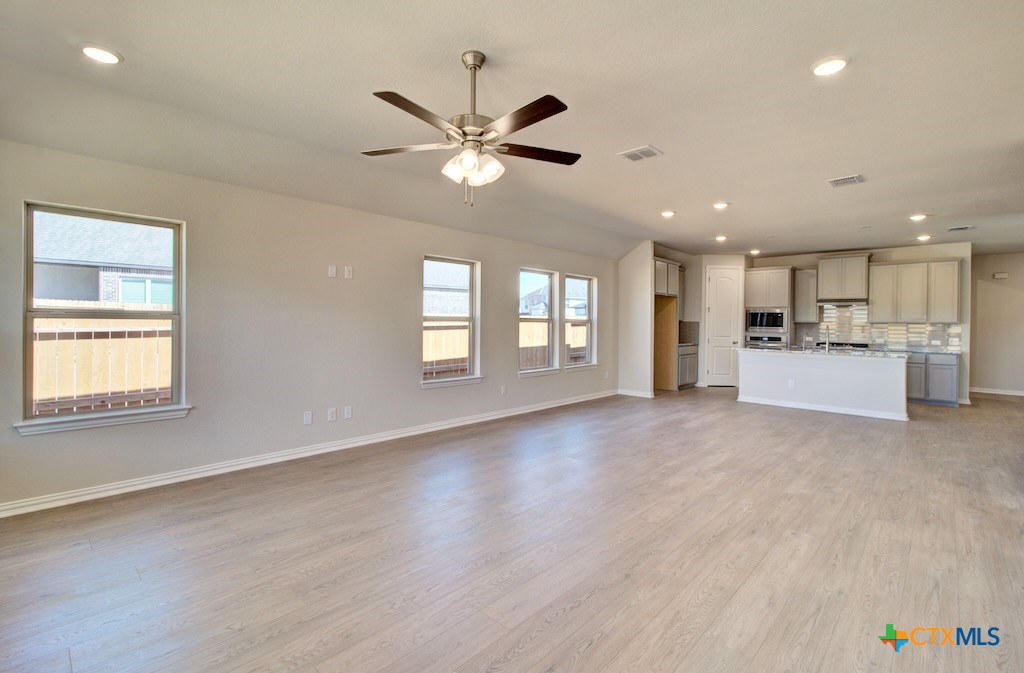2118 Shepard Street Seguin, TX 78155 - Photo 19 of 24 a view of a livingroom with a window and wooden floor