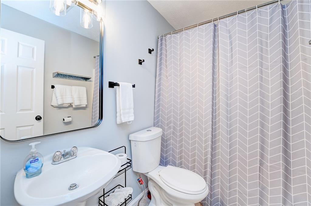 41 Summit Ridge Drive Southeast Cartersville, GA 30120 - Photo 12 of 43 a white toilet sitting next to a bathroom sink