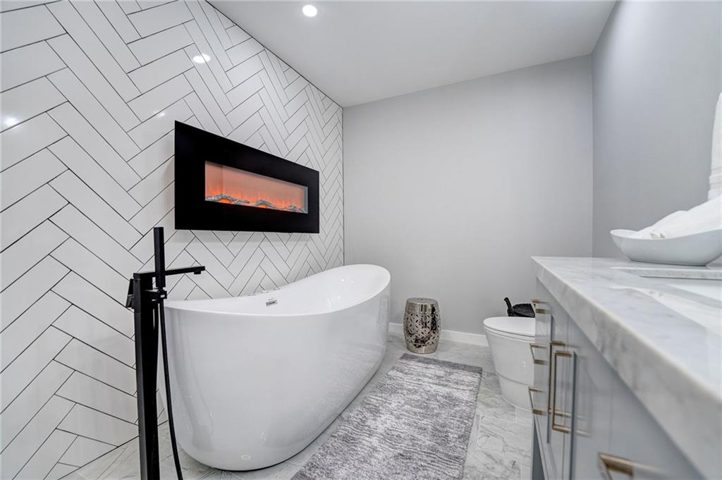 41 Summit Ridge Drive Southeast Cartersville, GA 30120 - Photo 18 of 43 a bathroom with a sink a toilet and mirror