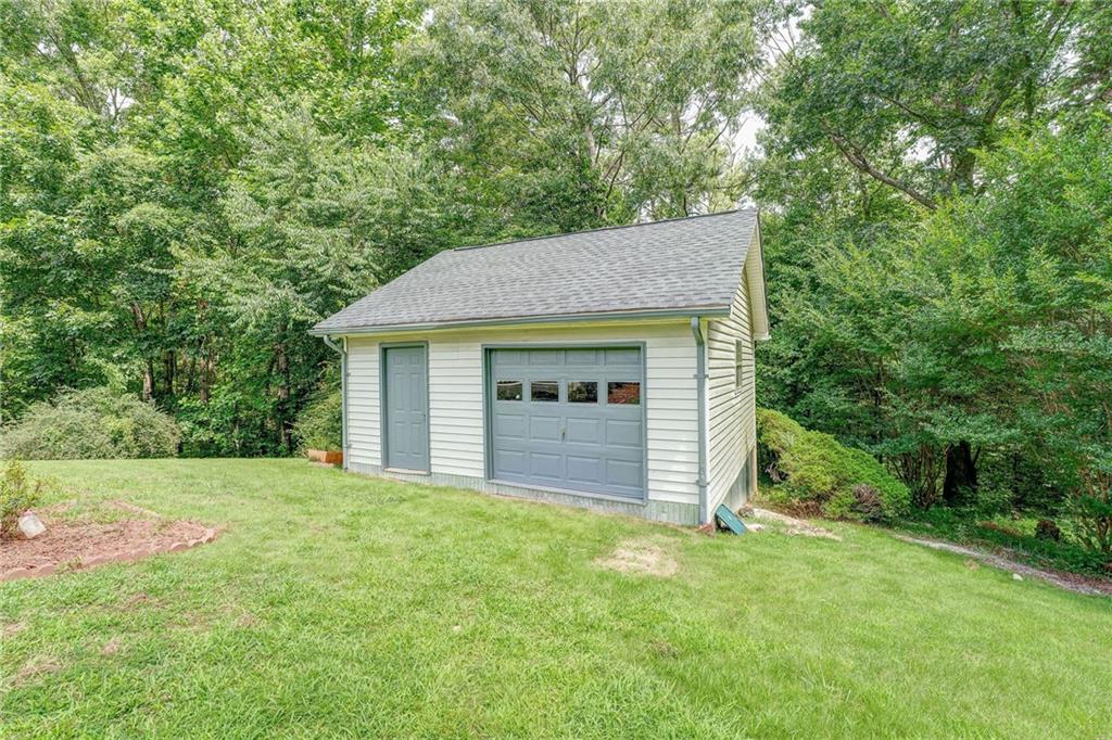 41 Summit Ridge Drive Southeast Cartersville, GA 30120 - Photo 22 of 43 a view of a house with a yard and large tree