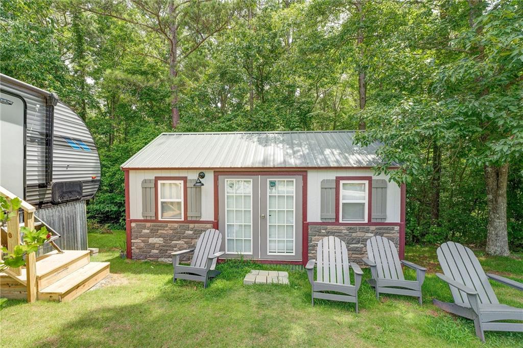 41 Summit Ridge Drive Southeast Cartersville, GA 30120 - Photo 30 of 43 a house view with a seating space and garden