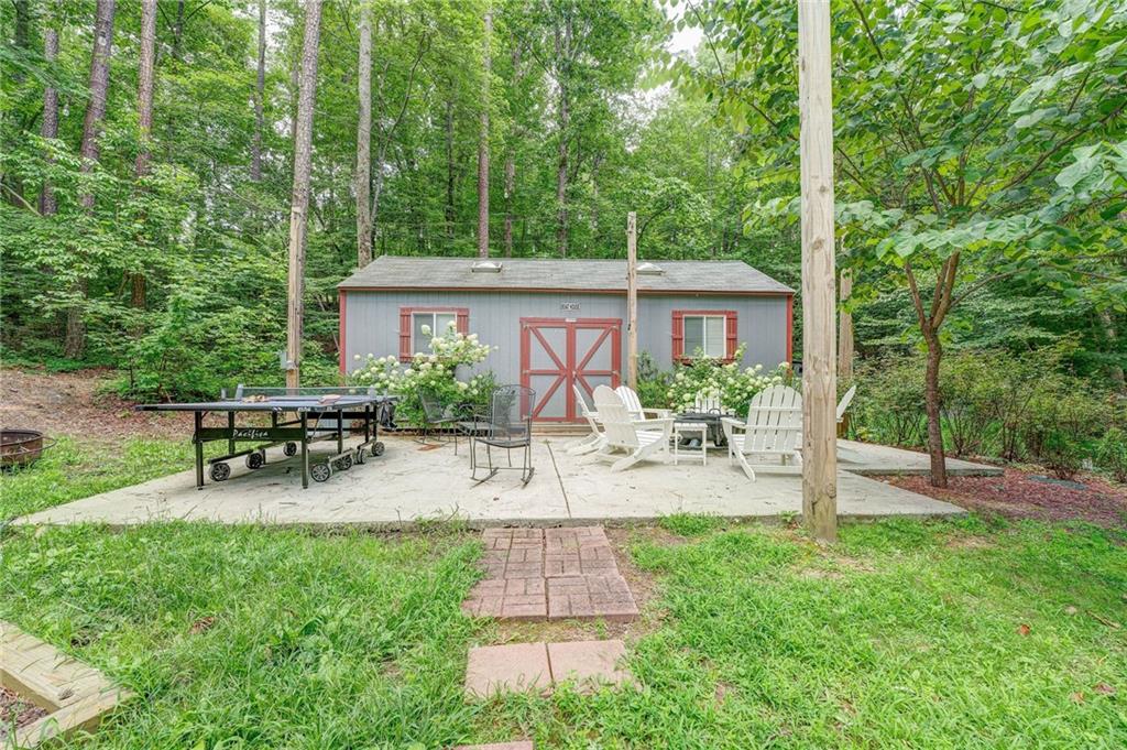41 Summit Ridge Drive Southeast Cartersville, GA 30120 - Photo 34 of 43 a view of a house with backyard and sitting area