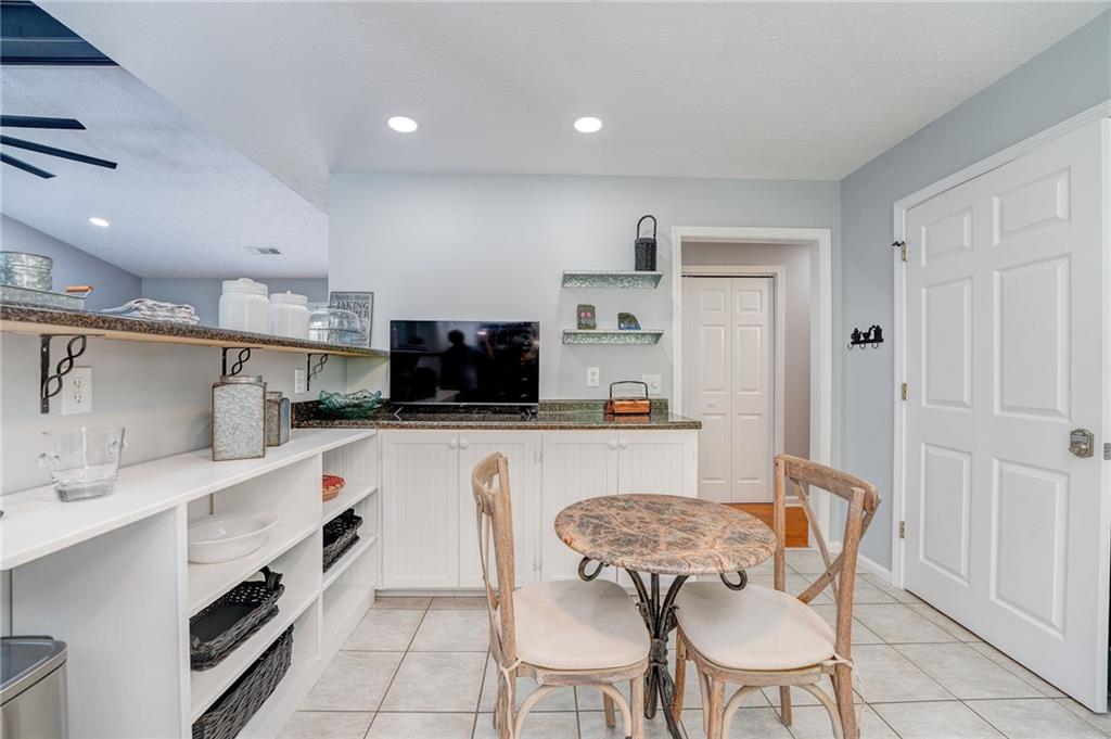 41 Summit Ridge Drive Southeast Cartersville, GA 30120 - Photo 9 of 43 a kitchen with stainless steel appliances kitchen island granite countertop a sink and cabinets