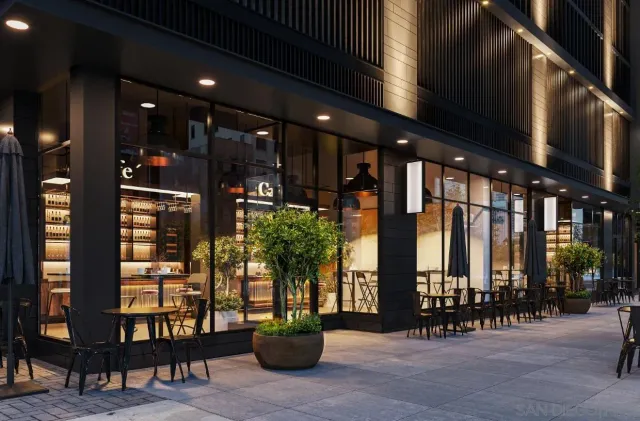 a building exterior with furniture and a large window