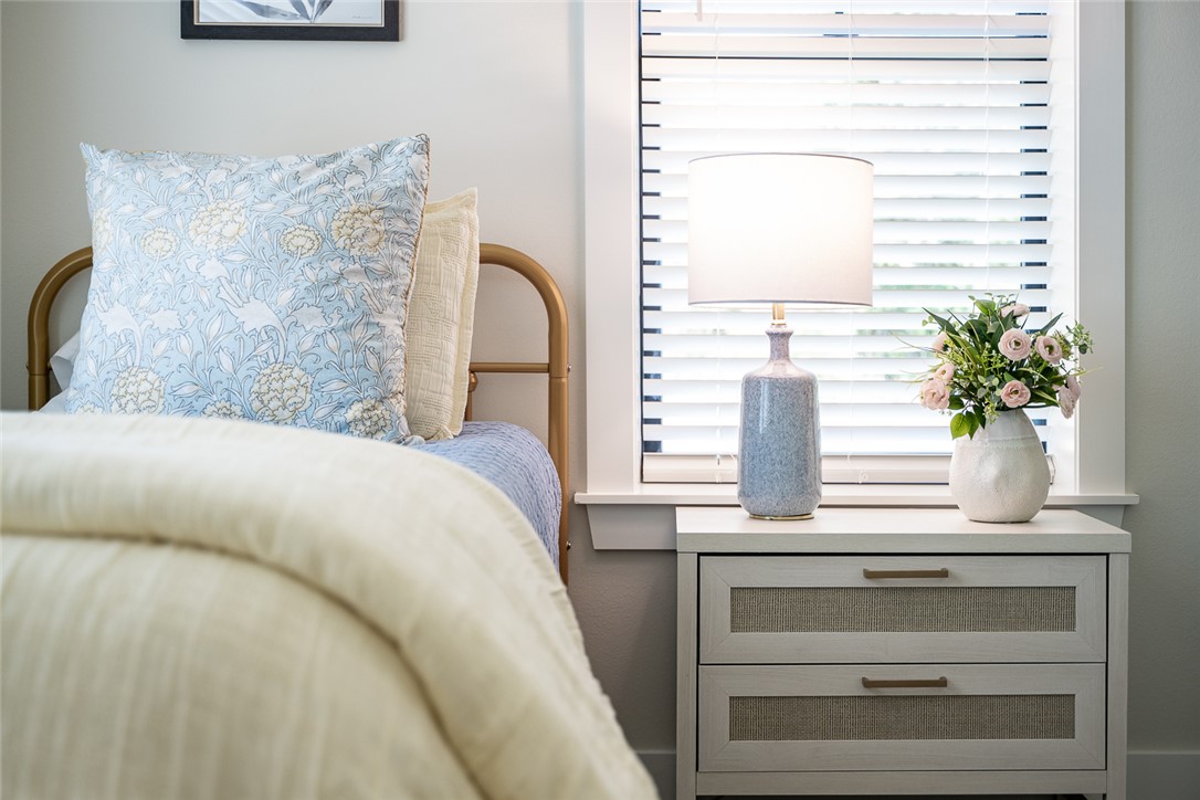 6876 Koppe Bridge Road College Station, TX 77845 - Photo 16 of 23 a bedroom with a bed and a window