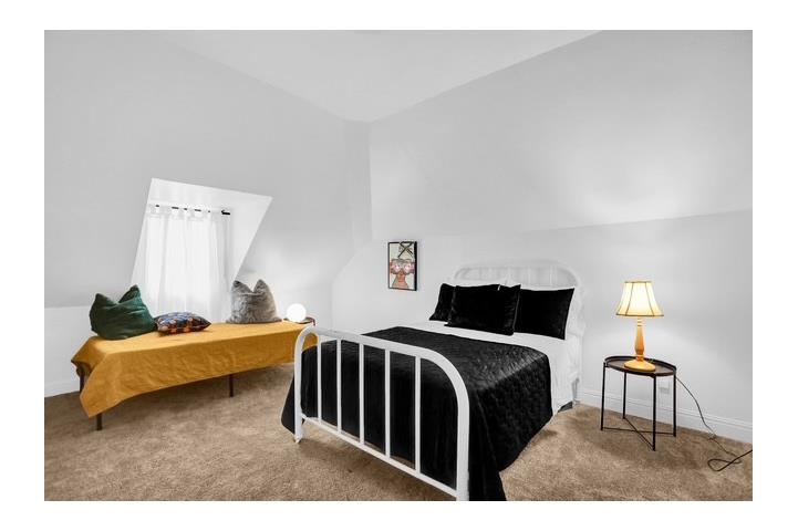 2181 Madison Avenue Memphis, TN 38104 - Photo 14 of 18 a bedroom with a bed and a lamp