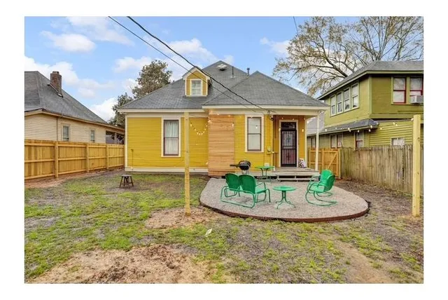 a view of a house with a bath tub and potted plants