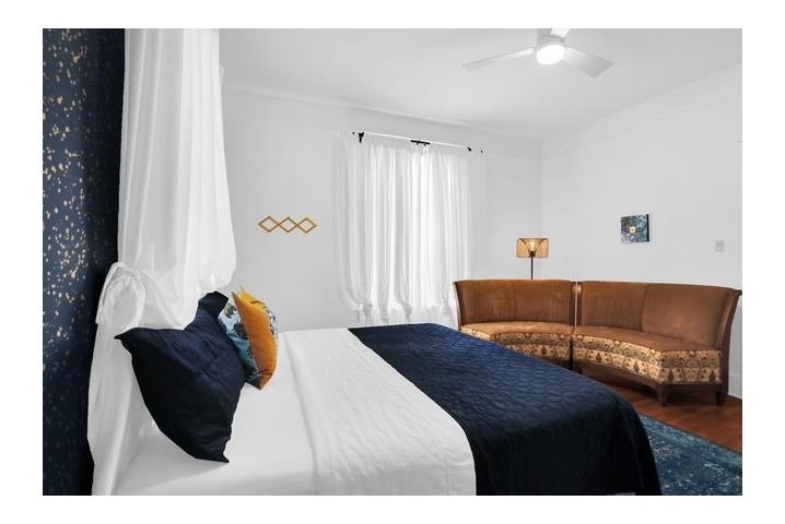 2181 Madison Avenue Memphis, TN 38104 - Photo 10 of 18 a bedroom with a bed and a couch