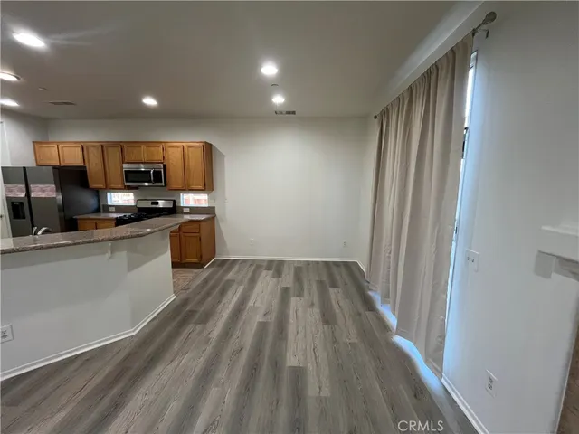 a view of kitchen with wooden floor
