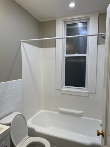 59 Spring Street, Unit 3 Wakefield, MA 01880 - Photo 4 of 5 a bathroom with a toilet and a bathtub