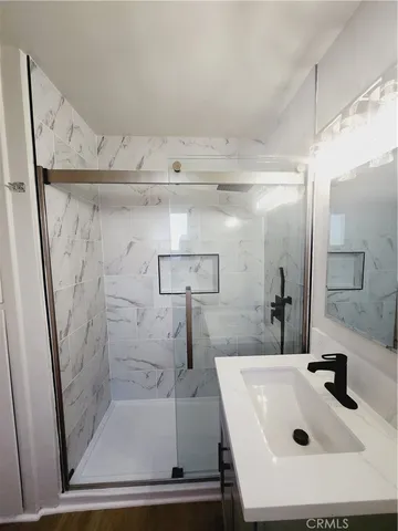 a bathroom with a sink and a shower