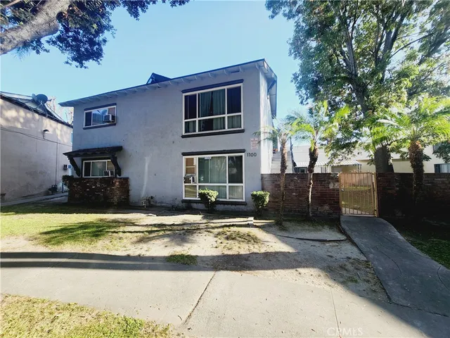 a view of a house with swimming pool and sitting area